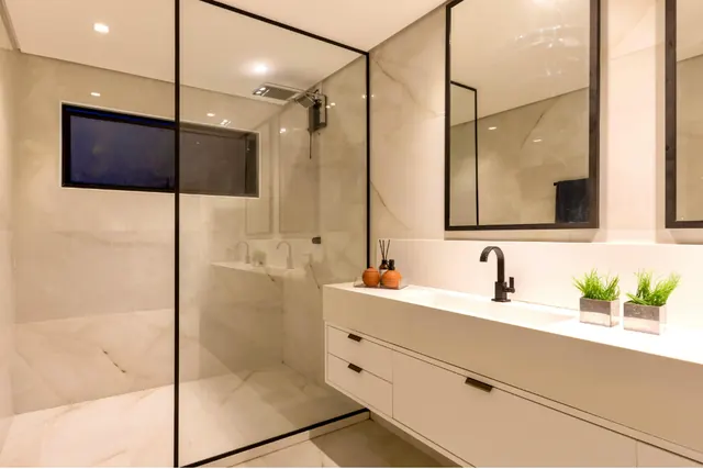 Spotless walk-in shower and vanity after a deep clean